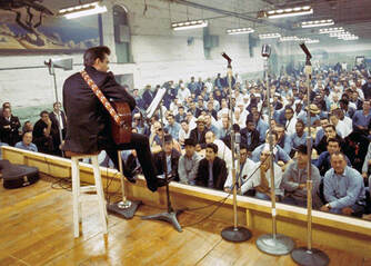 Picture: Johnny Cash performs at a prison