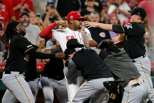 Picture: Reds reliever Amir Garrett takes on entire Pirates team on July 30. 
