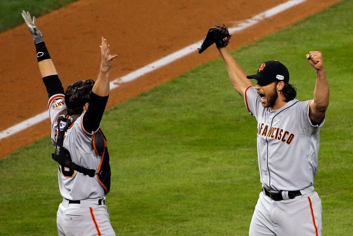 Picture: Giants pitcher Madison Bumgarner celebrates World Series win with catcher Buster Posey