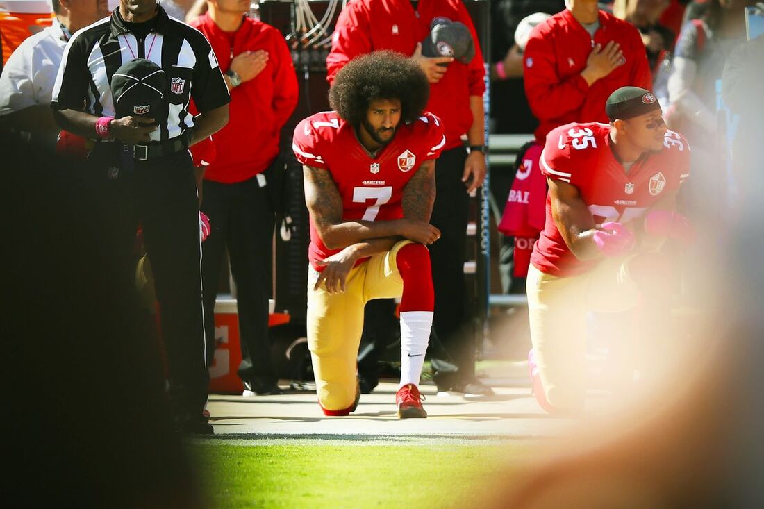 Picture: 49ers quarterback Colin Kaepernick protests police brutality by kneeling during National Anthem