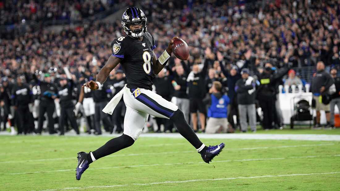 Picture: Lamar Jackson runs in a touchdown for Baltimore Ravens