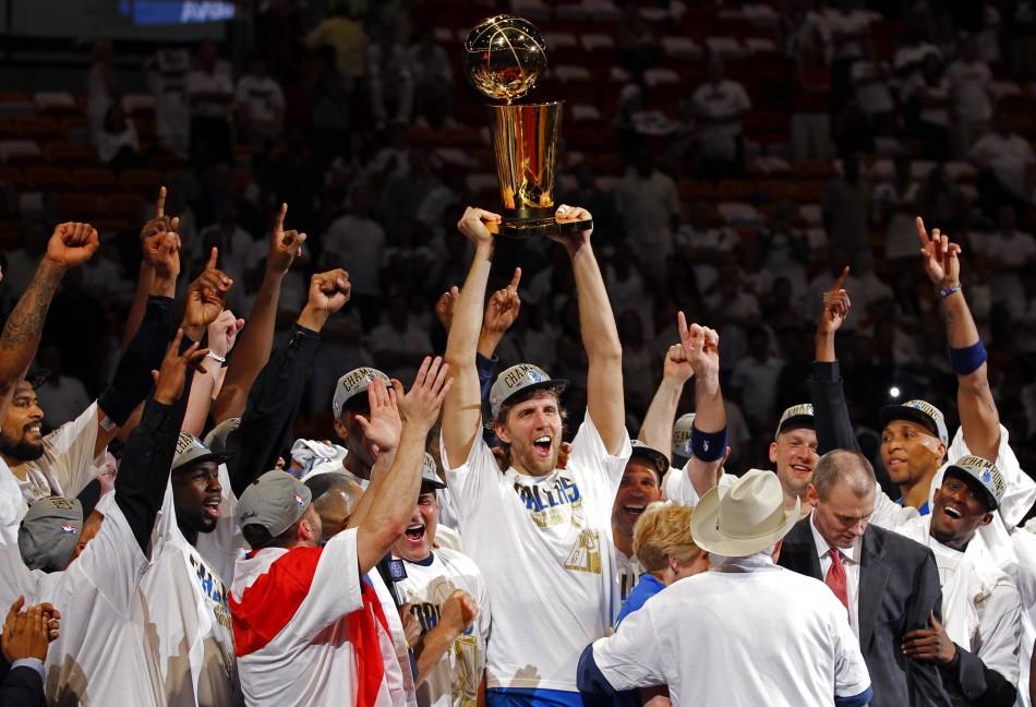 Picture: Dallas Mavericks star Dirk Nowitzki holds up NBA championship trophy