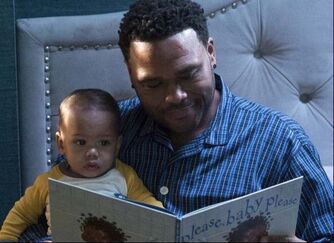 Picture: Dre (Anthony Anderson) reads a story to his baby Davante on episode of 'black-ish'