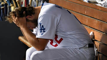Picture: A distraught Clayton Kershaw in dugout during game 5 of NLDS