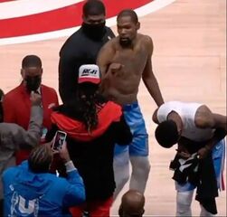 Picture: Kevin Durant fist bumps 2 Chainz on sideline after NBA game while Kyrie Irving autographs jersey for him