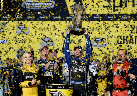 Picture: Jimmie Johnson celebrates his fifth straight NASCAR title