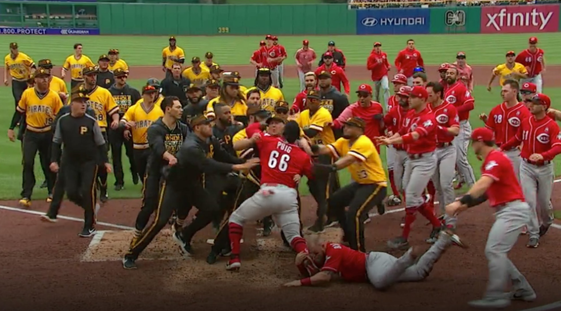 Picture: Reds outfielder Yasiel Puig takes on entire Pirates team in brawl in early April. 
